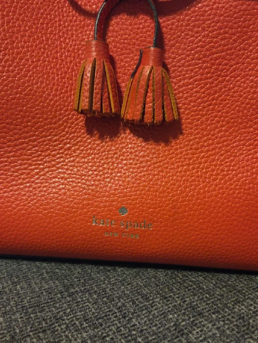 kate spade orange pebbled leather tote with tassel